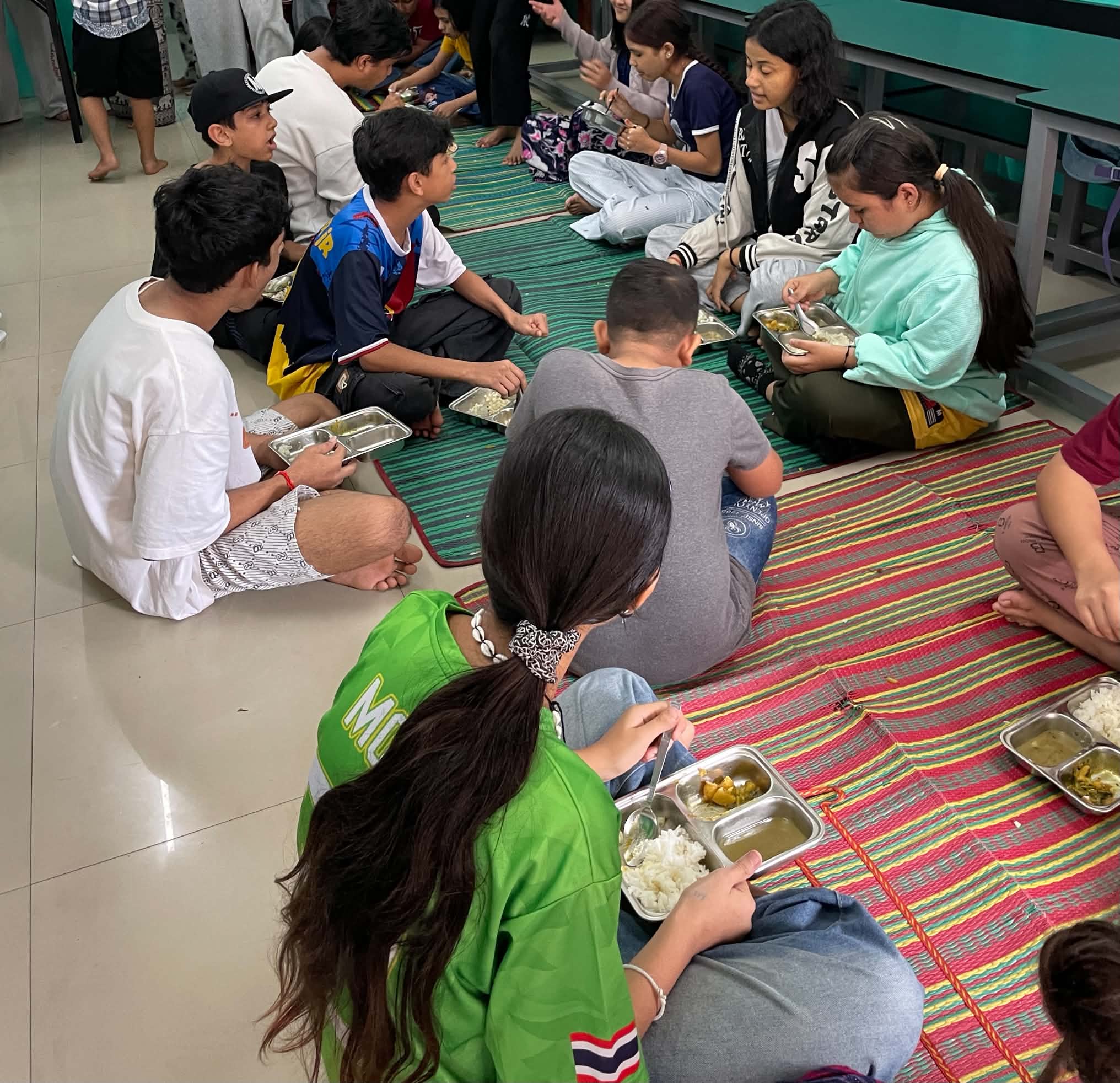 Children sharing a meal at Arise and Shine